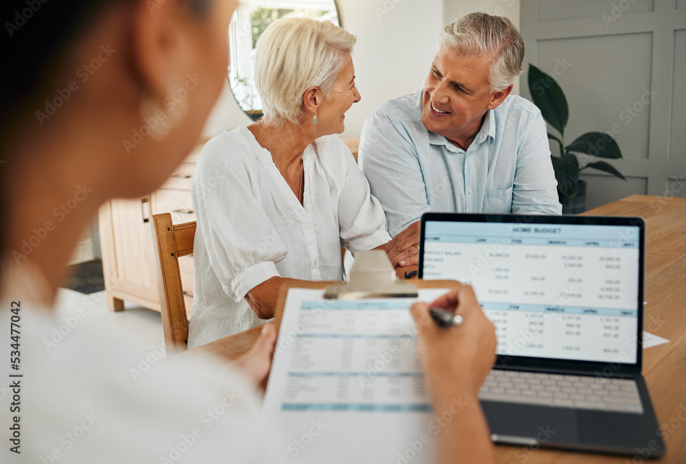 Smiling-senior-couple- discussing-their-home- budget-with-a-financial- advisor-reviewing- documents-on-a-laptop- and-clipboard